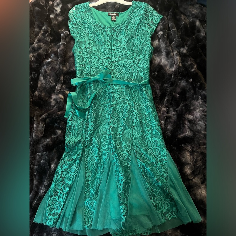 Lovely teal sparkly dress with ribbon and tulle on bottom.